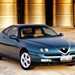 1998 Alfa Romeo GTV: blue front angle on sand (Aus)