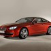 2012 BMW F13.I 650i Coupe: orange red front quarter, studio