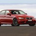 BMW E90 M3 Sedan: red front quarter