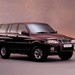 1998 Daewoo Musso: burgundy front quarter studio