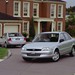 1999 Ford KN Laser: silver front quarter and rear two shot (Australia)