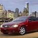 2006 Holden VE.I Berlina: red front quarter city at night (Australia)