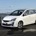 2013 Proton FZ Exora GXR: white front quarter at beach (Australia)